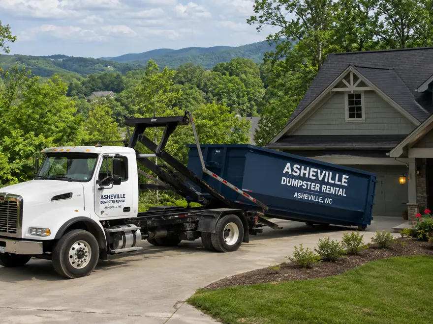 Asheville Dumpster Rental roll-off truck delivering a dumpster in Asheville, NC